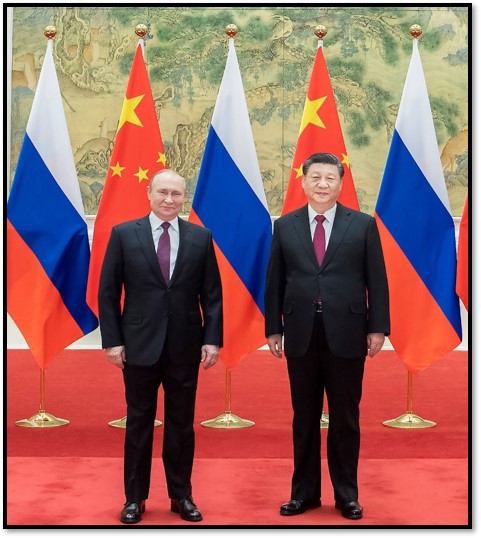 Two men in suits standing in front of flags

Description automatically generated with medium confidence