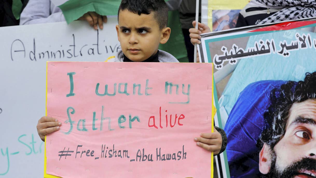 Hisham
                Abu Hawash's son at a protest in Dura, in January. 