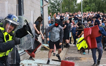 Rioters fight police during an anti-immigration protest in outside a Holiday Inn in Rotherham reportedly housing immigrants.