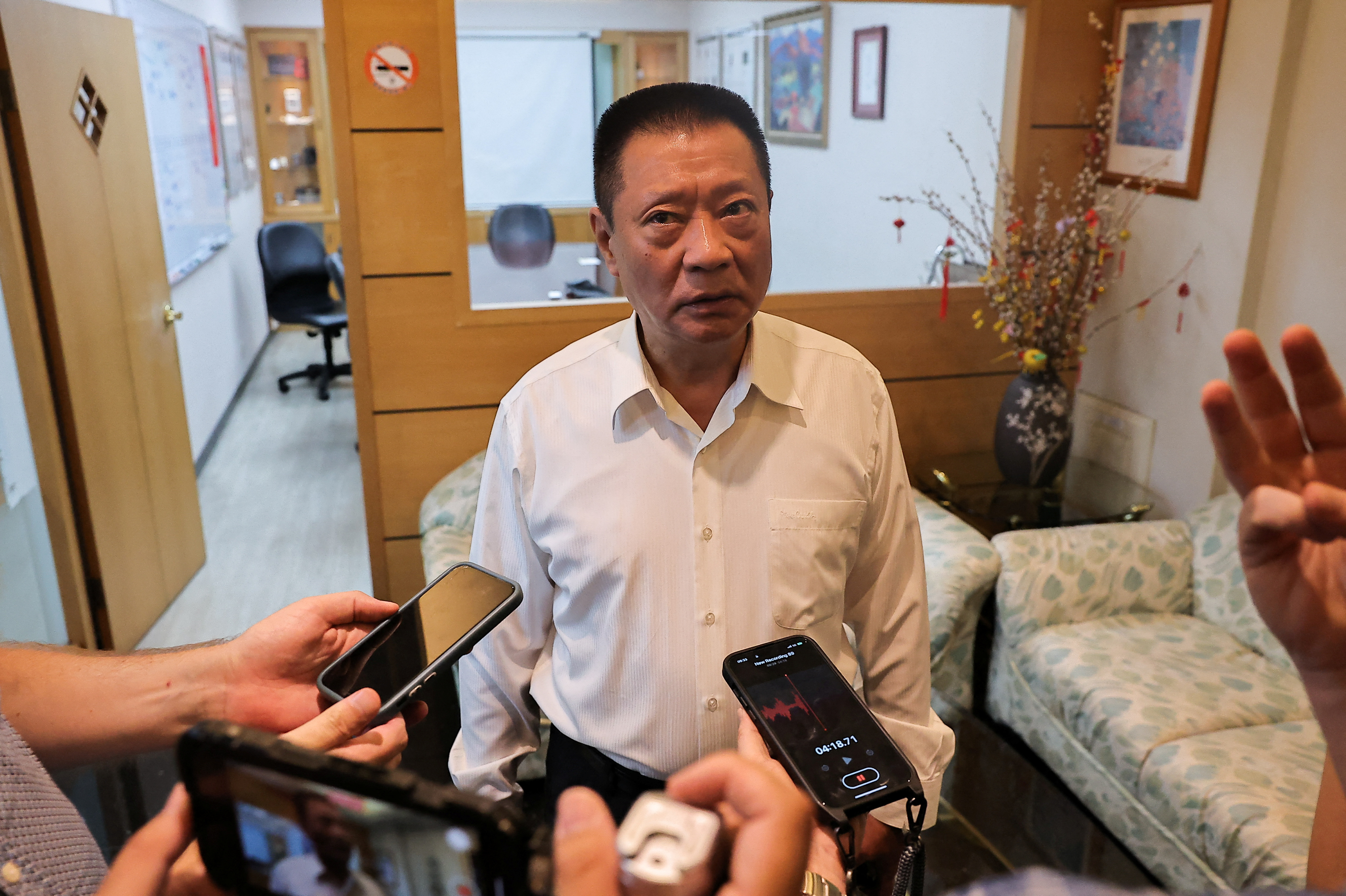 Hsu Ching-kuang, founder and president of Gold Apollo speaks to the media at their office in New Taipei City