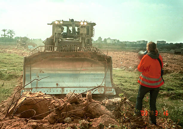 American peace activist Rachel Corrie tries to stop an Israeli bulldozer from destroying Palestinian land March 16, 2003 in the Rafah refugee camp in....jpeg