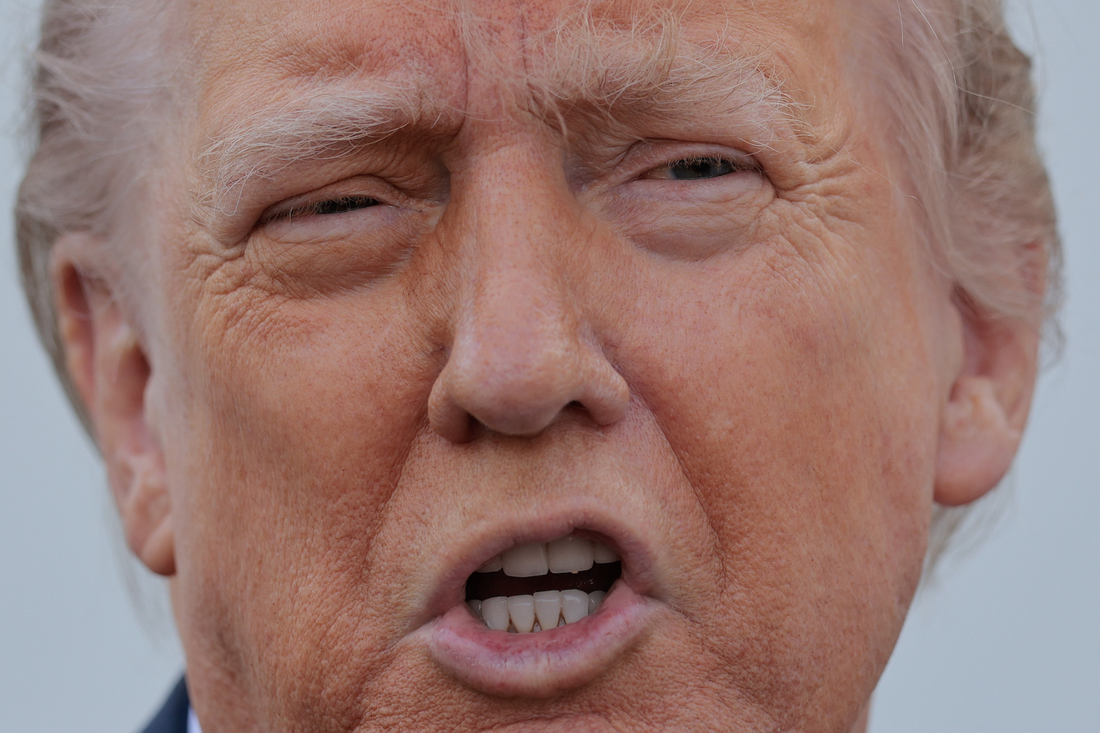 President Donald Trump talks to reporters after inspecting the North Lawn with members of the White House grounds crew to look for a place to put a 100-foot-tall flag pole on April 23, 2025. (Photo by Chip Somodevilla/Getty Images)