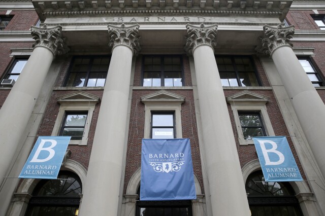 Banners hang from a building at Barnard College, May 28, 2015, in New York. (AP Photo/Seth Wenig, File)