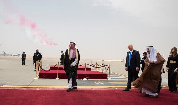 President Trump and King Salman of Saudi Arabia walk on a red carpet at the airport in Riyadh, Saudi Arabia, in 2017. 