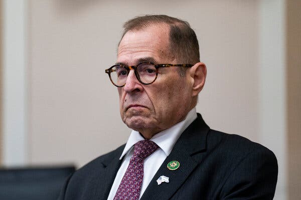 Representative Jerry Nadler, wearing a suit and tie and glasses, has a dour look on his face.