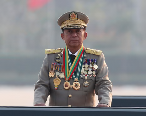 Min Aung Hlaing standing in a military uniform covered in medals