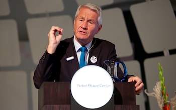 Mr Jagland lecturing at a podium