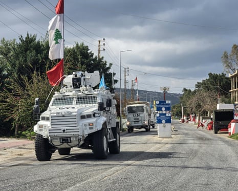 UN peacekeepers drive past a Lebanese army outpost in the area of Naqura in southern Lebanon on Friday