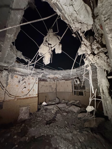 Damage seen inside the building with the ceiling totally collapsed.