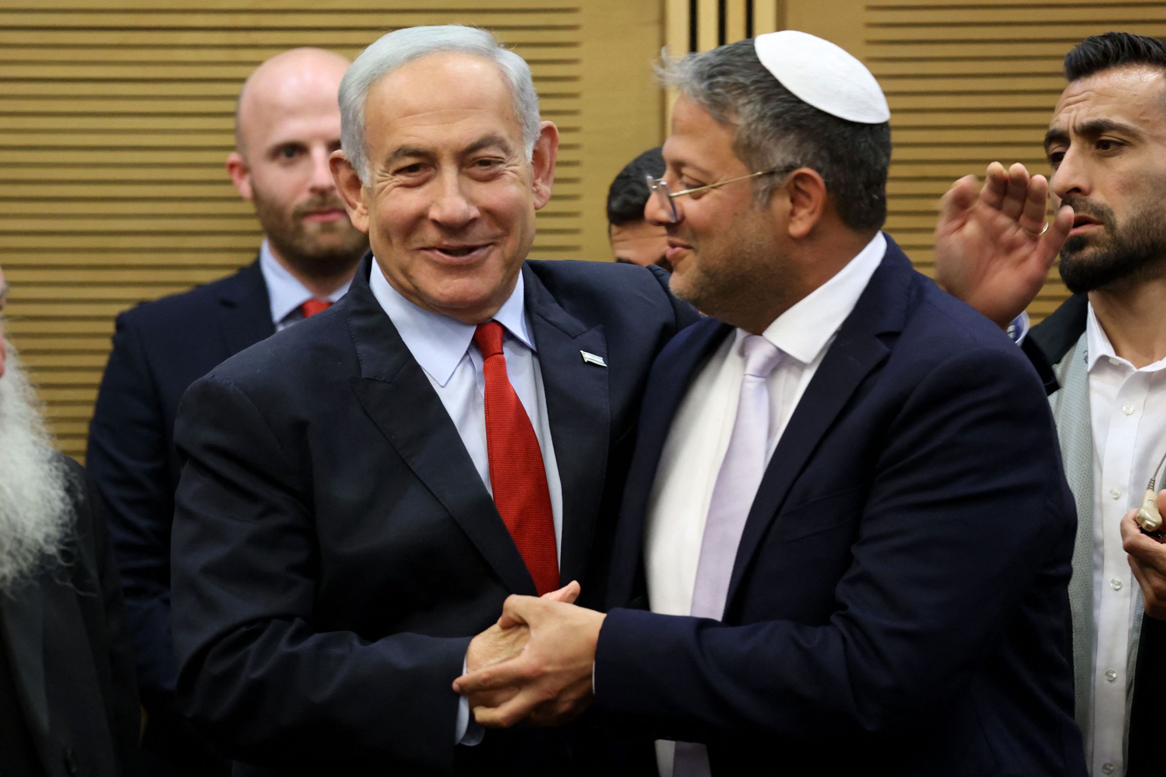 Israeli Prime Minister Benjamin Netanyahu (L) greets National Security Minister Itamar Ben-Gvir.