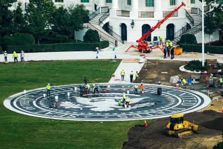 construction continues on a helipad-cum-cocktail patio on the south lawn of the White House