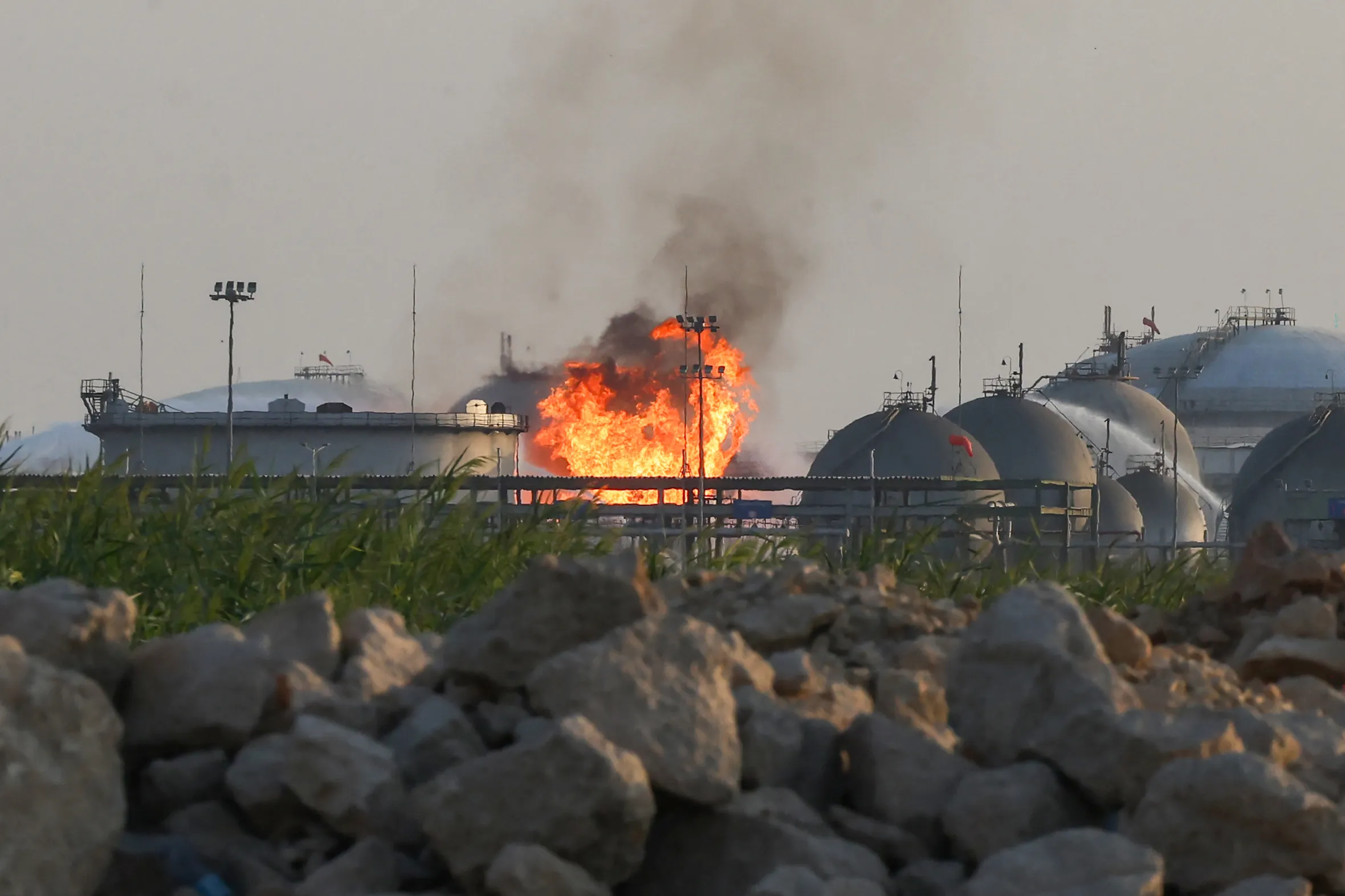 Flames and thick smoke rise from a Saudi Aramco oil facility south of Riyadh.